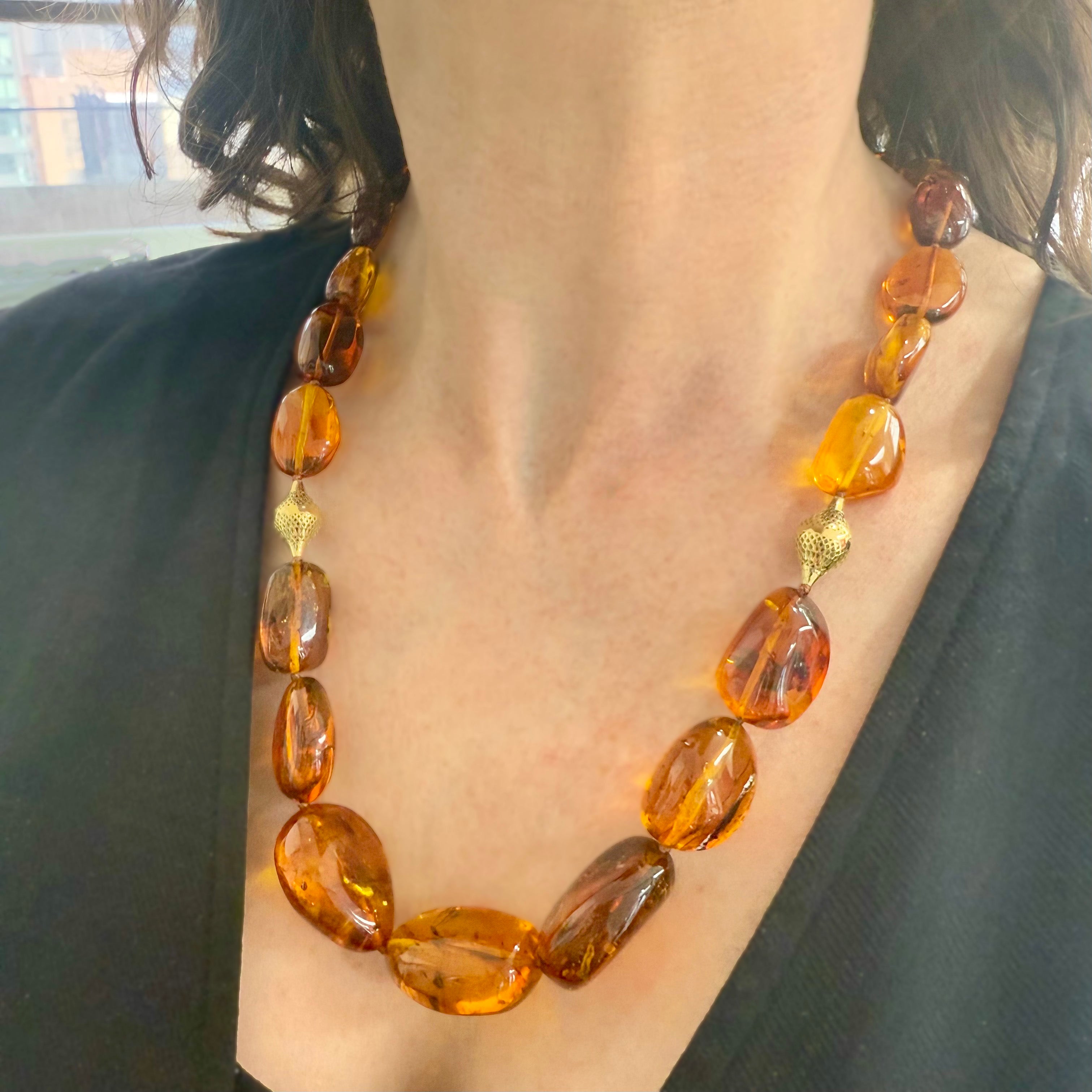 Baltic amber beads with preserved ancient insects, strung with gold clasp
