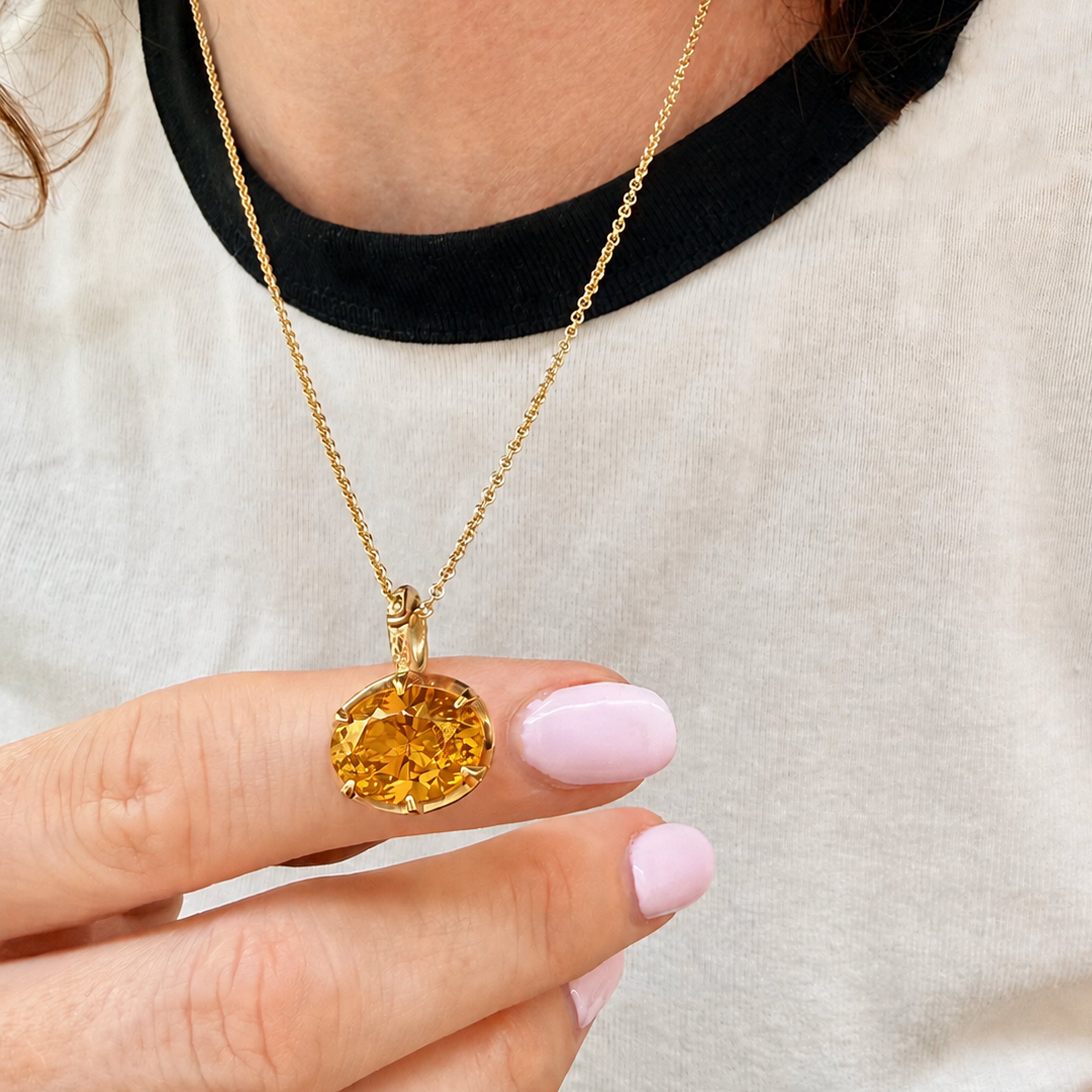 Citrine birthstone pendant on gold chain, front view