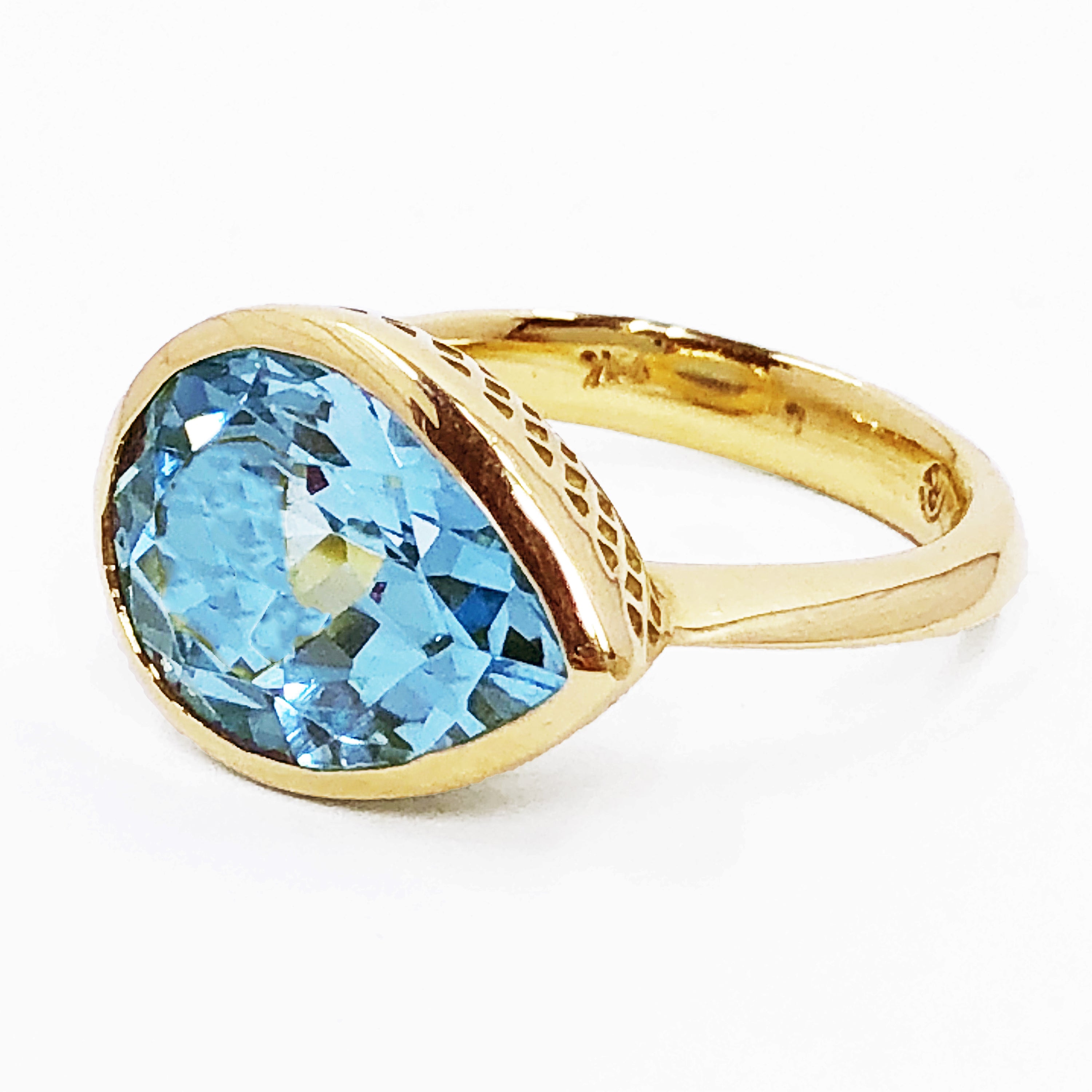 18K Yellow Gold Crownwork® Ring with East-West Pear Shaped Blue Topaz