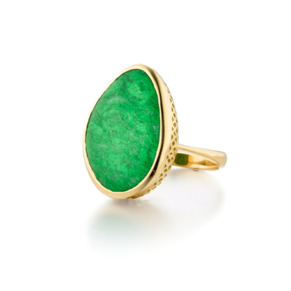 This is a photo of an asymmetrical bright green burmese jade ring set in 18k yellow gold