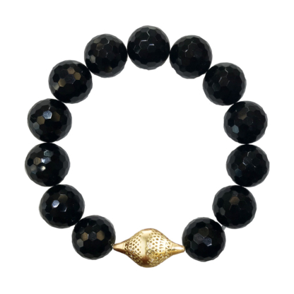 The is a photo of a faceted onyx stretch bracelet with gold final.