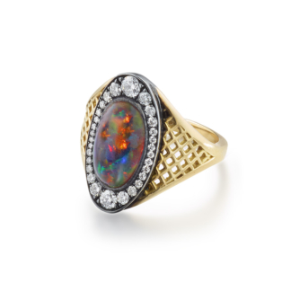 This is a photo of a black opal ring with pave diamond surround in 18k yellow gold crownwork setting