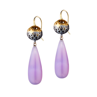 This image is of chalcedony drop earrings hanging off an 18k yellow gold and oxidized silver ball
