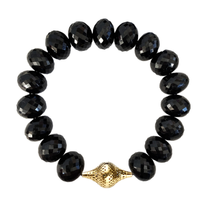 this is a black spinel stretch bracelet with yellow gold finial