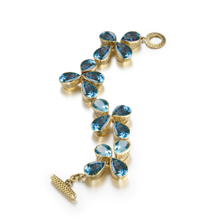 this is a blue topaz pear shape bezel set bracelet