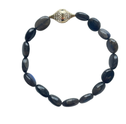 this is a labradorite stretch bracelet with 18k yellow gold crownwork finial