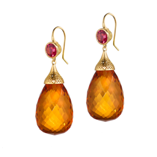 This is a picture of bezel set garnet earring with faceted amber drops