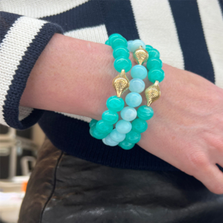This image shows an amazonite stretch bracelet stacked with others. Its a guide on how to style it.