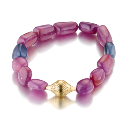 This image shows a stretch bracelet made with pink and blue sapphire beads, it is fine jewelry and unisex