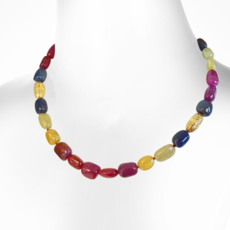 This is an image of a multicolored sapphire beaded necklace on a white bust