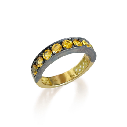 This is an product photo of a yellow sapphire stacking band with the stones set in oxidized silver