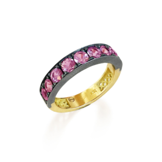 This is a product image of a pink sapphire pave stacker ring set in oxidized silver with a yellow gold band