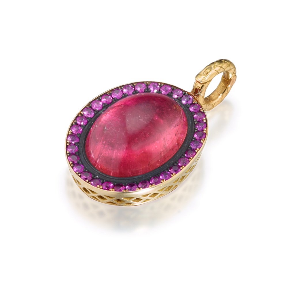This is a product shot of a pink tourmaline pendant with a pave pink sapphire surround