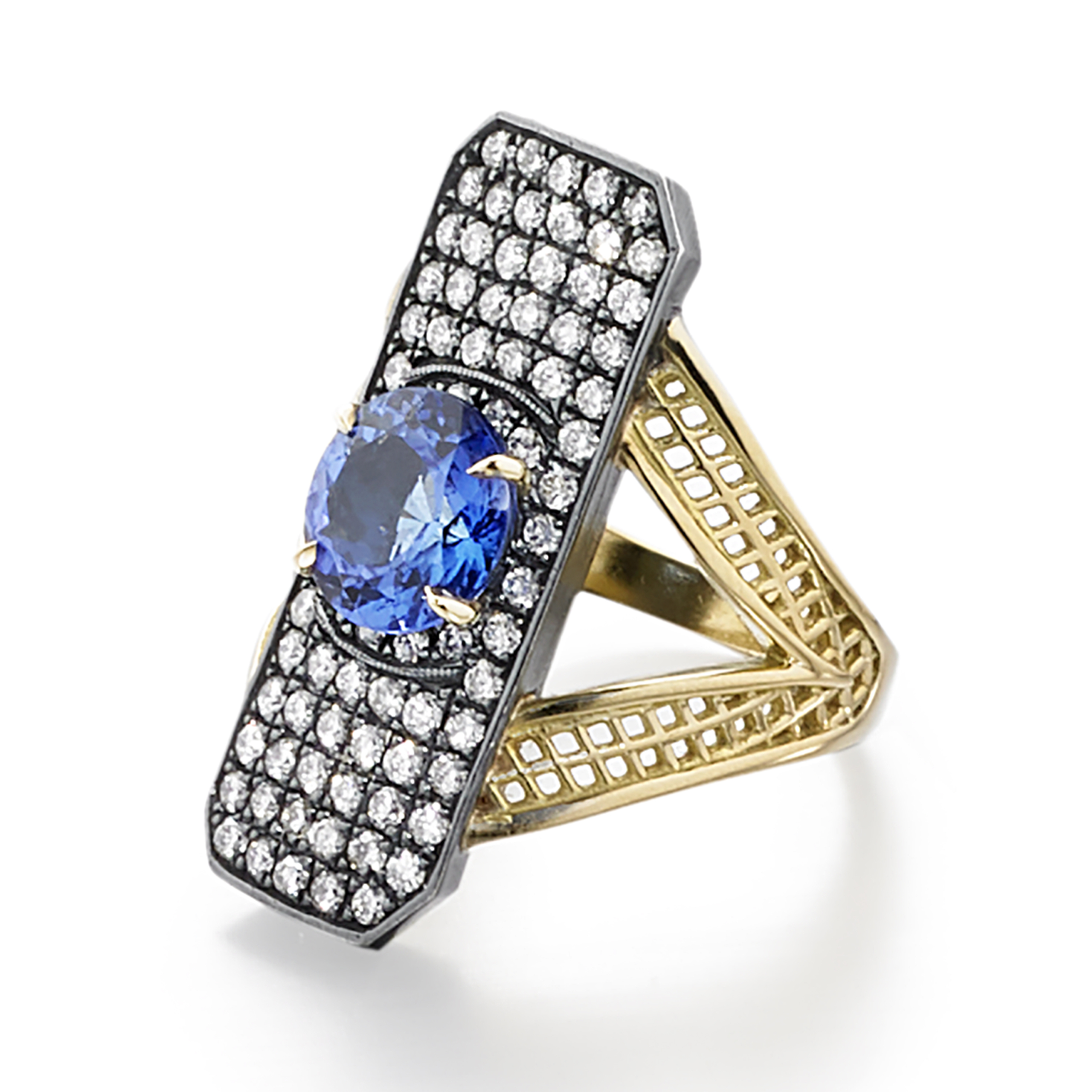 This is a photo of an 18k yellow gold Crownwork Edwardian ring with prong set tanzanite center and pave diamond surround in oxidized silver