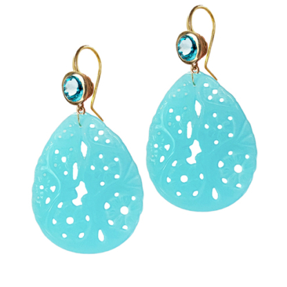 This is a product shot of blue zircon earrings with carved laguna drops