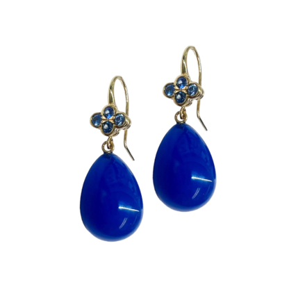 This is a product shot showing these sapphire earrings with bright blue agate drops