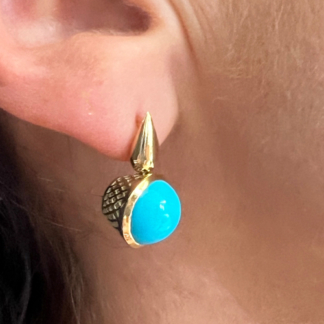 This image is showing the way these turquoise earrings sit on the ear