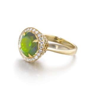 This is a photo of an 18k yellow gold 10mm Crownwork bezel set Green Tourmaline ring with pave diamond surround