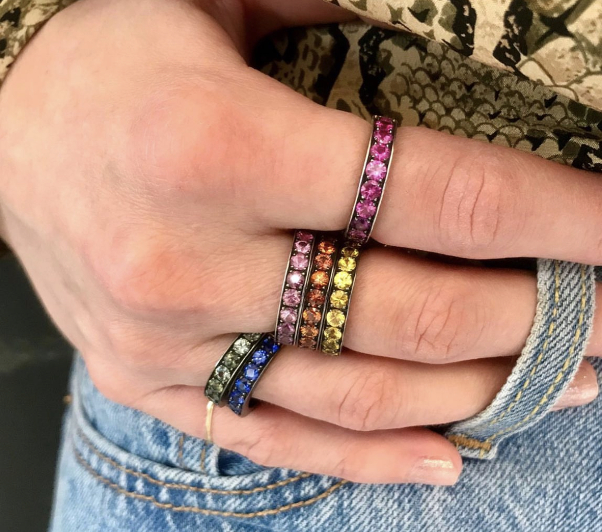 This is a photo of colorful stacker bands worn on the hand