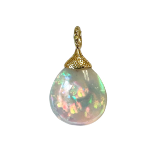This is a photo of an Ethiopian opal pendant with 18k yellow gold crownwork top