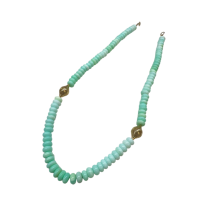 This is a photo of a soft green Peruvian opal necklace with two small 18k yellow gold crownwork finials