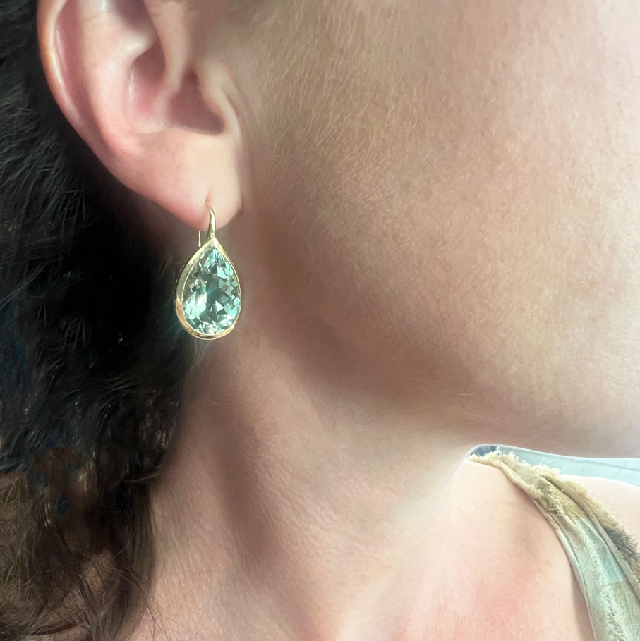 This is a photo of 18k Yellow gold crownwork earrings with green amethyst