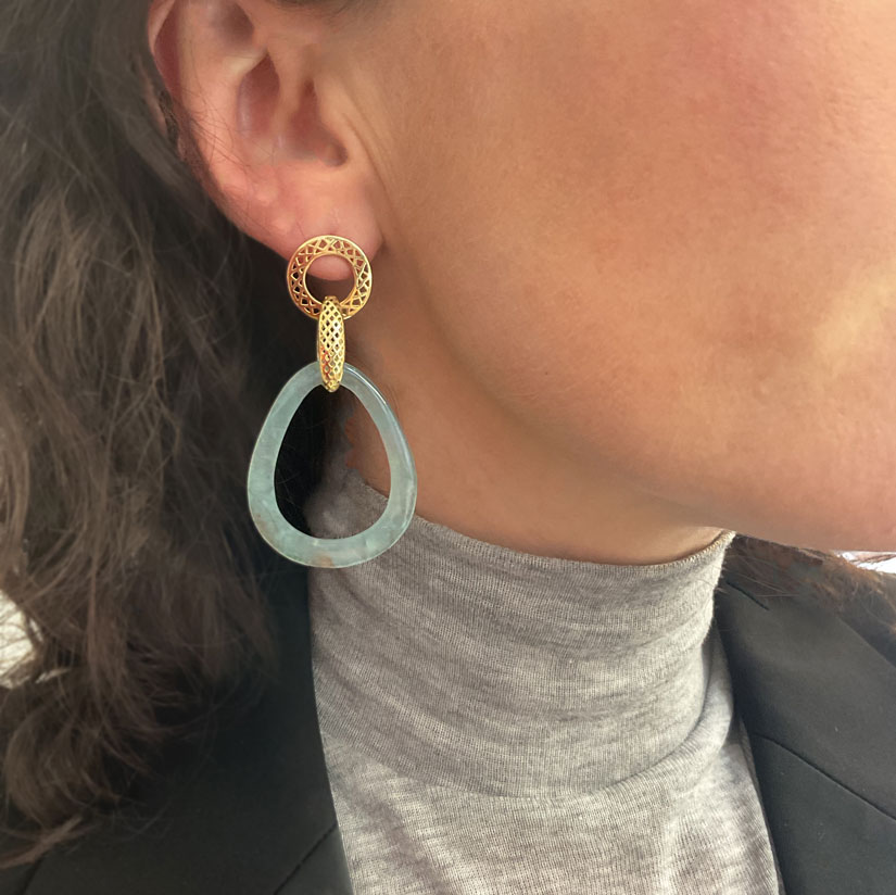 Aquaprase frame drop earrings being worn