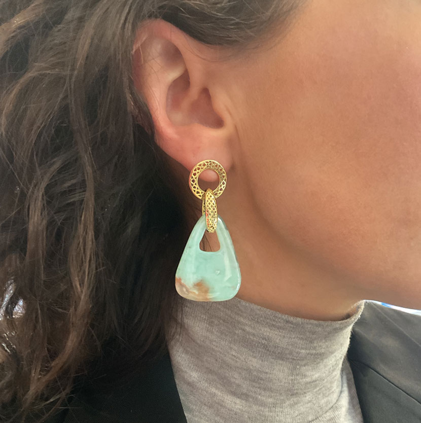 This is pair of one of kind triangular drop earrings