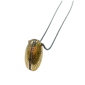 This is a photo of an 18k Yellow gold crownwork egg pendant with pave champagne diamonds